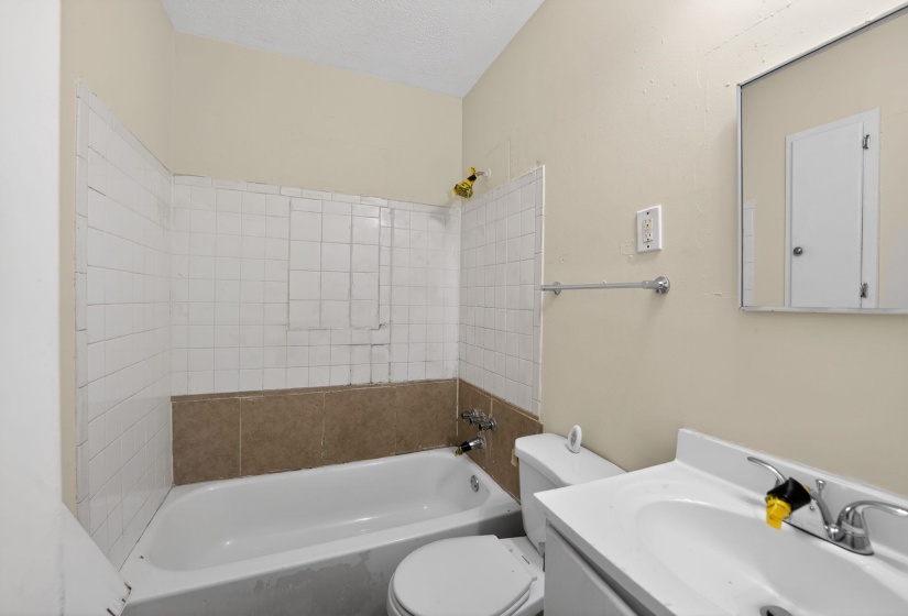 Full bath featuring vanity and tub / shower combination