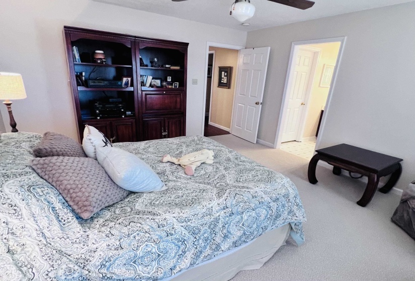 Bedroom featuring light colored carpet and a ceiling fan