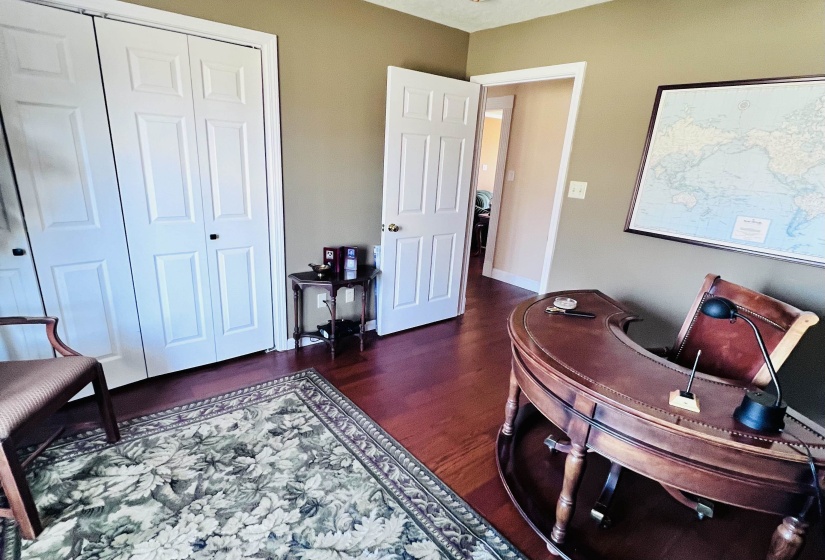 Office space with dark wood-type flooring