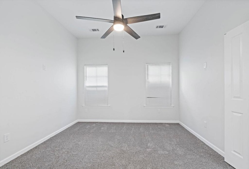 Unfurnished room with carpet floors and ceiling fan