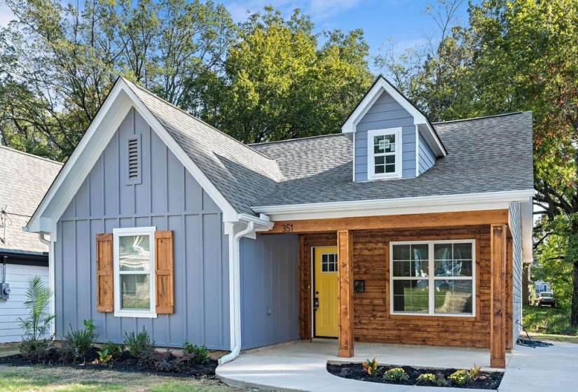 View of front of home featuring board and batten siding, a porch, and a shingled roof