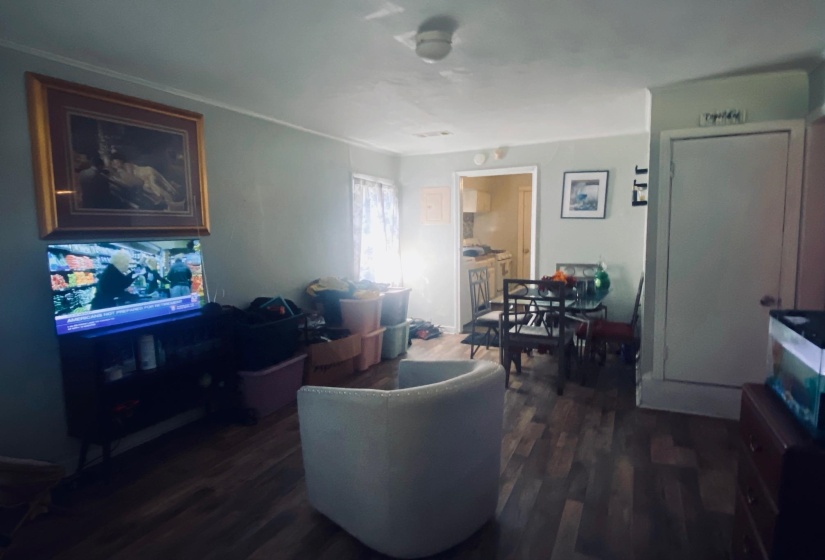 Living area with dark wood-style flooring