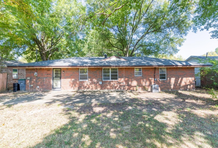 Back of house with brick siding