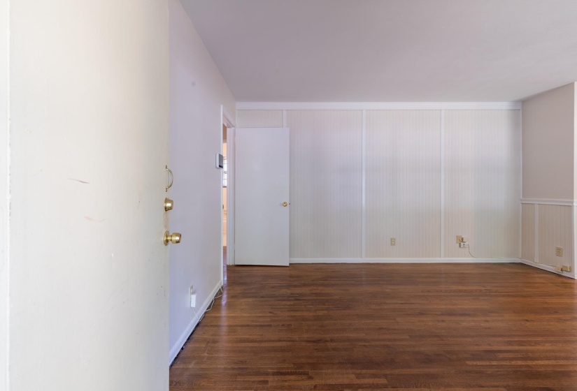 Spare room with wood finished floors and baseboards