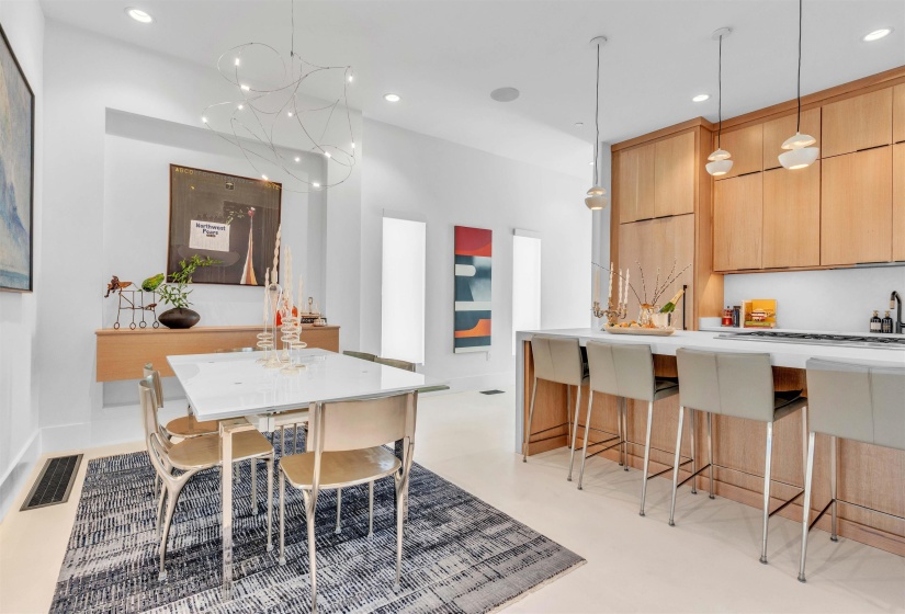 Dining area featuring concrete floors and a chandelier