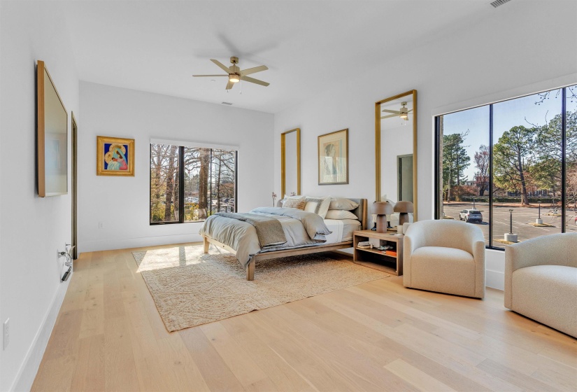 Bedroom featuring light wood-type flooring, ceiling fan, and access to outside