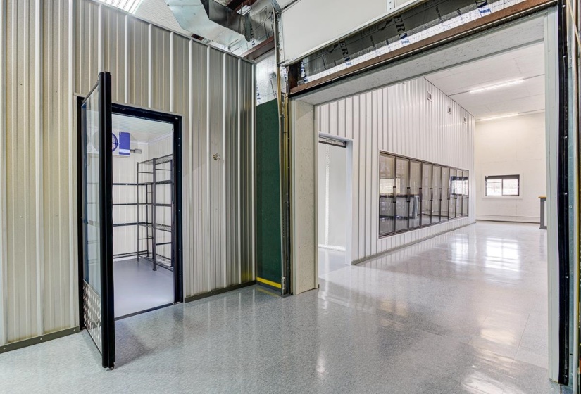 Garage featuring metal wall