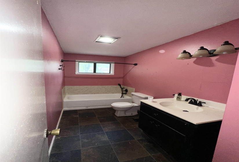Full bathroom featuring vanity,  shower combination, and a textured ceiling