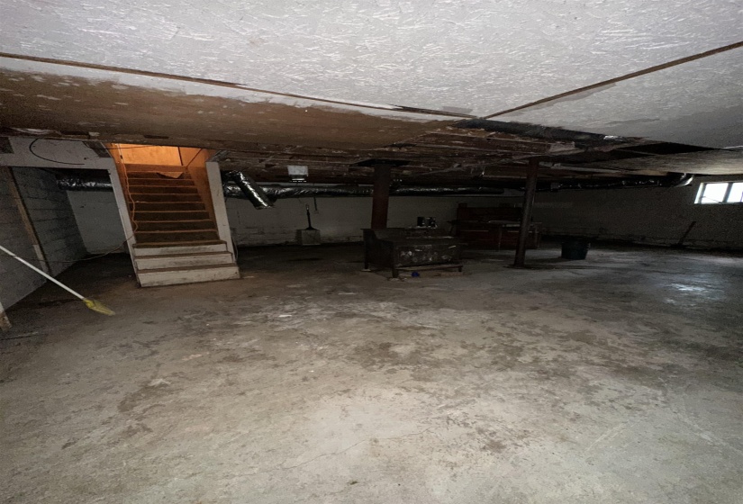 Basement featuring stairs