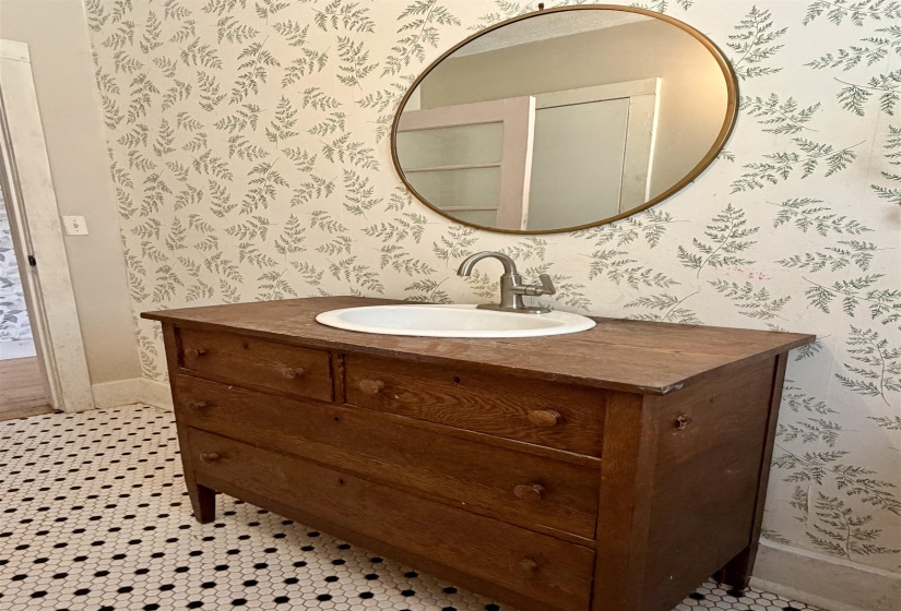 Bathroom featuring vanity and light floors