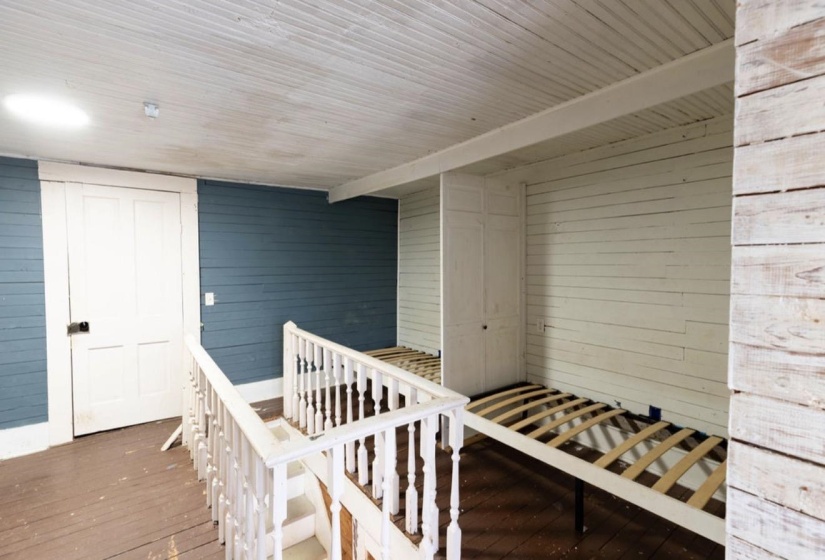 View of exterior entry featuring a wooden deck