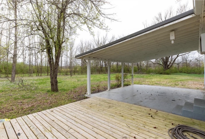 Wooden terrace with a yard
