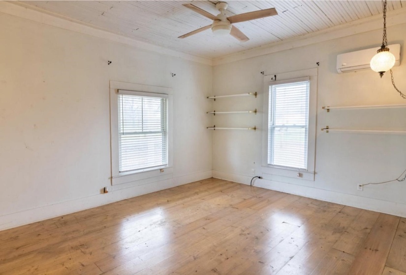 Spare room with light wood finished floors, wooden ceiling, and ceiling fan