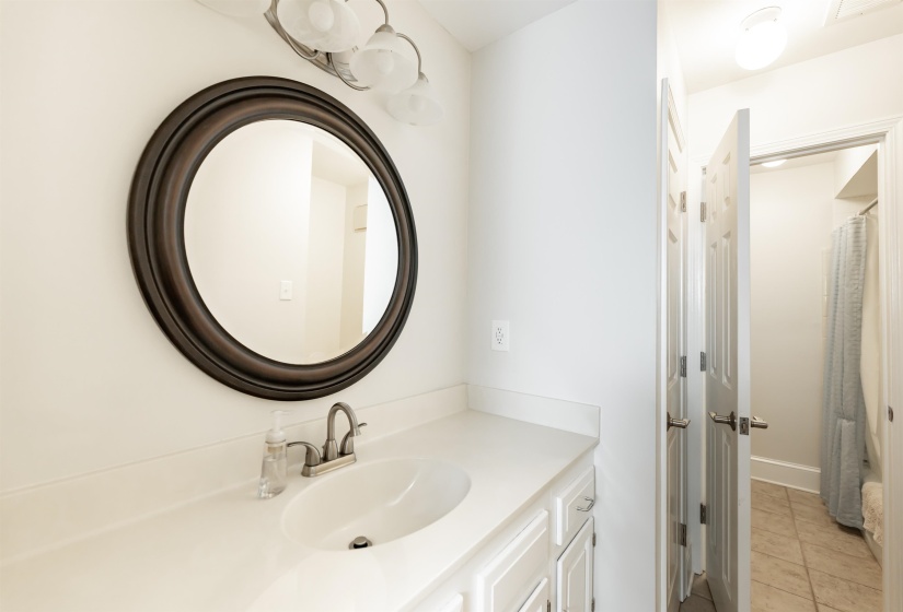 Bathroom with vanity and light tile patterned flooring
