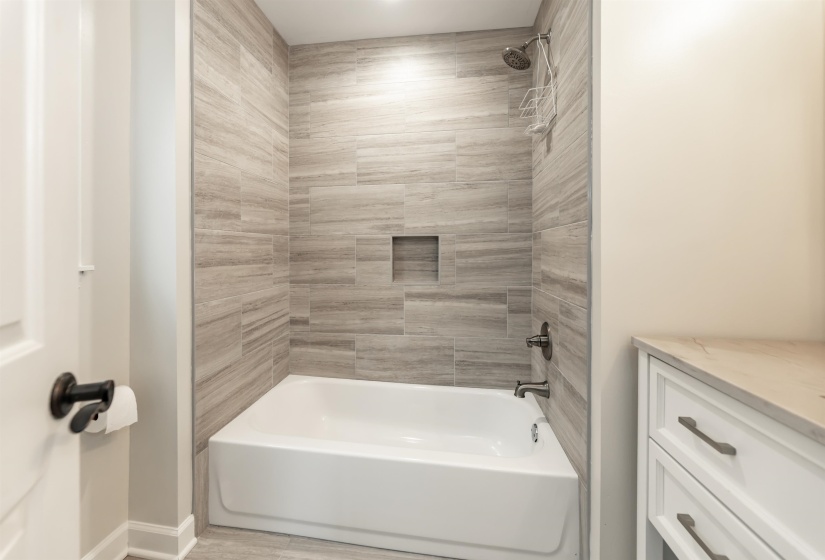 Bathroom with tub / shower combination and vanity