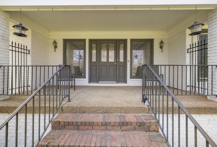 Entrance to property with brick siding