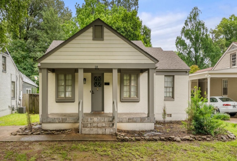 Bungalow-style home featuring covered porch, brick siding, roof with shingles, and crawl space