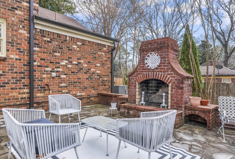 View of patio featuring an outdoor living space with a fireplace