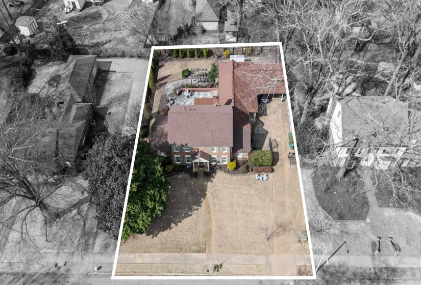 Aerial view of property and surrounding area featuring property boundaries highlighted
