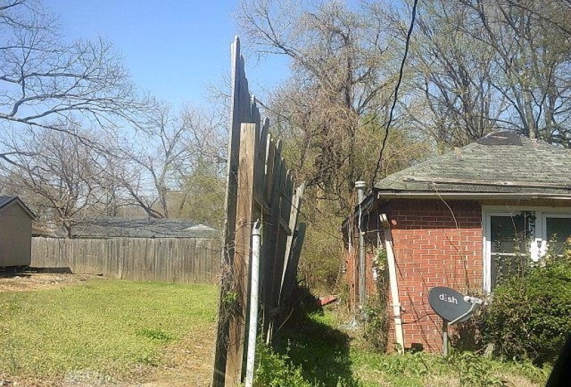 View of side of home with brick siding