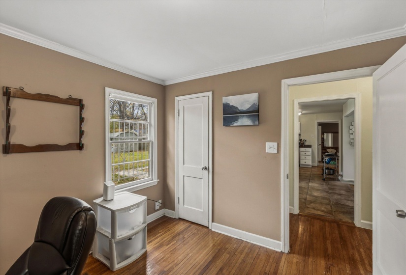Office featuring dark wood finished floors and ornamental molding
