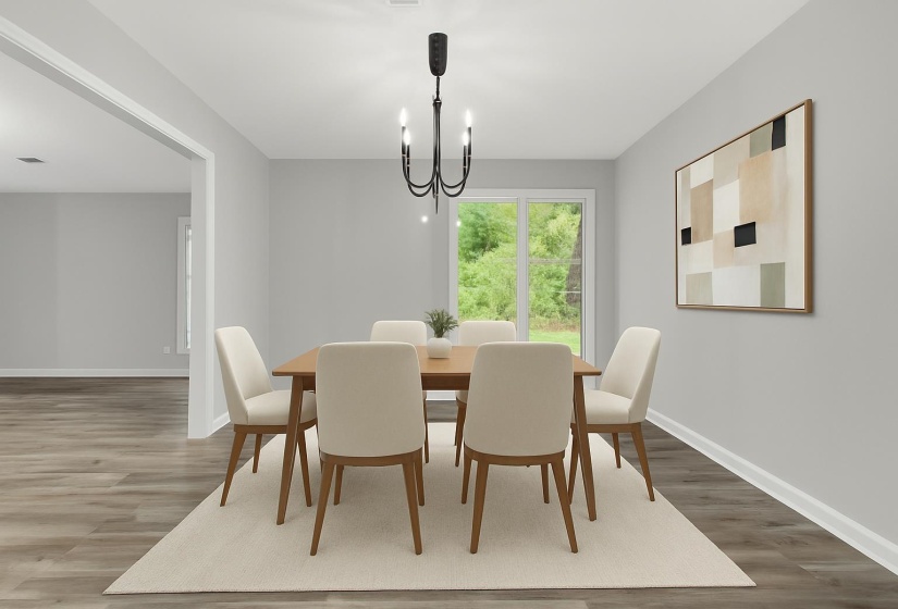 Dining room with wood finished floors and a chandelier