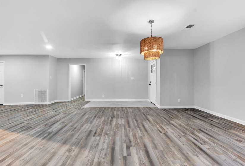 Unfurnished room with baseboards and wood finished floors