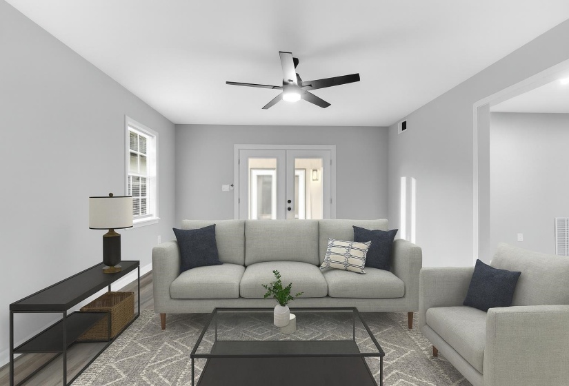 Living room featuring wood finished floors, french doors, and ceiling fan