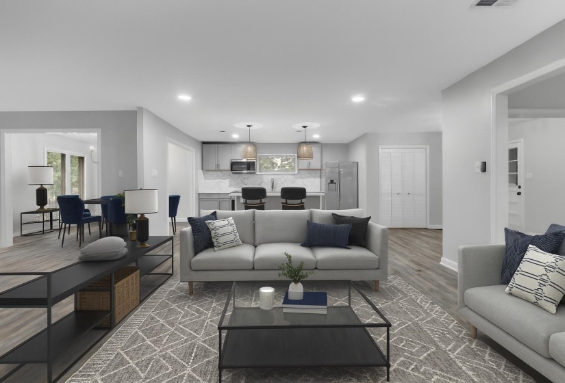 Living room with recessed lighting and wood finished floors