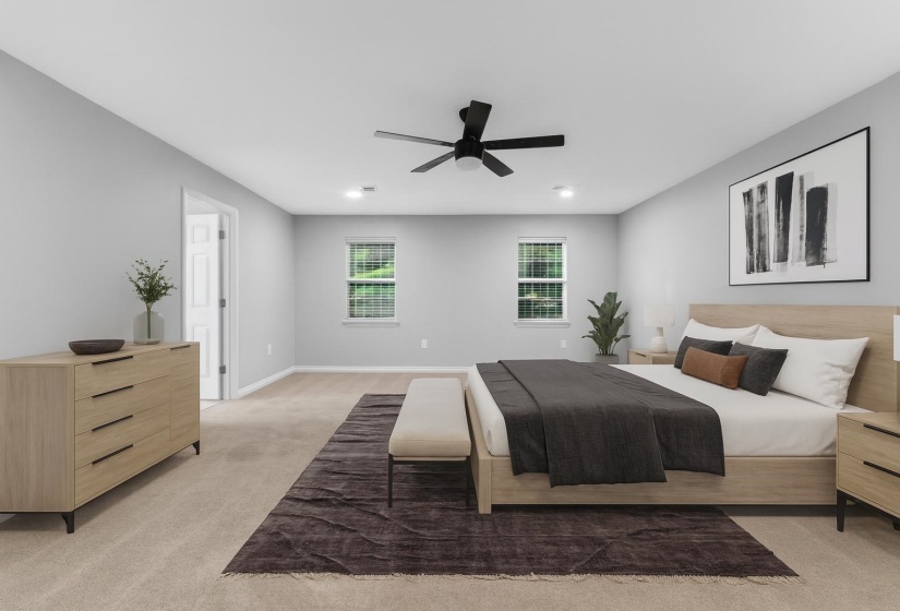 Bedroom featuring light carpet and a ceiling fan
