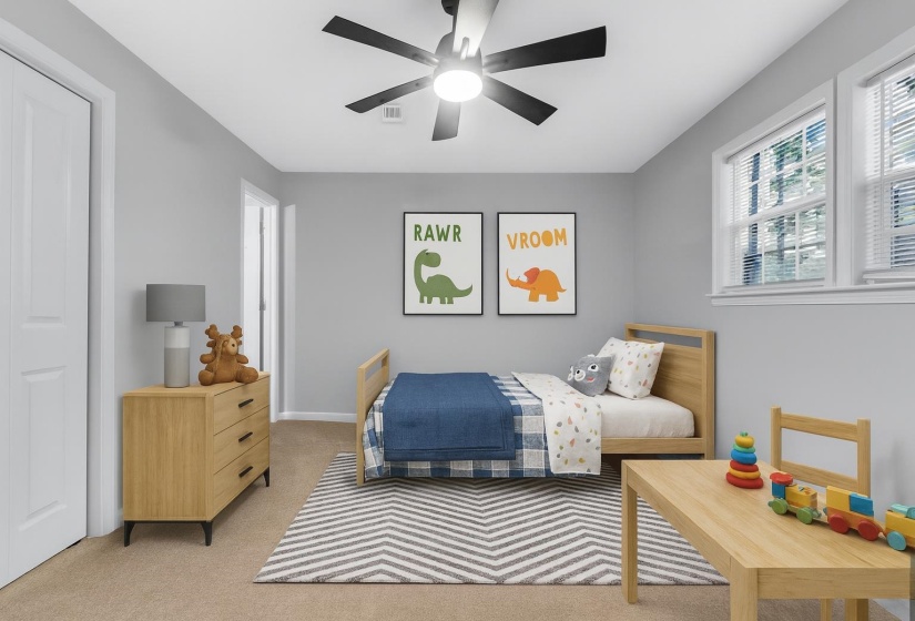 Bedroom featuring light colored carpet and a ceiling fan