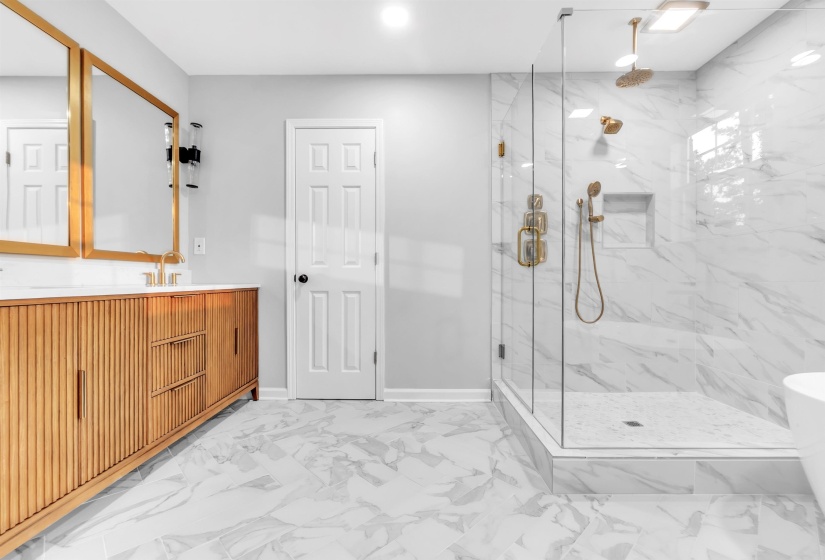 Full bath featuring a marble finish shower, vanity, marble finish flooring, baseboards, and recessed lighting