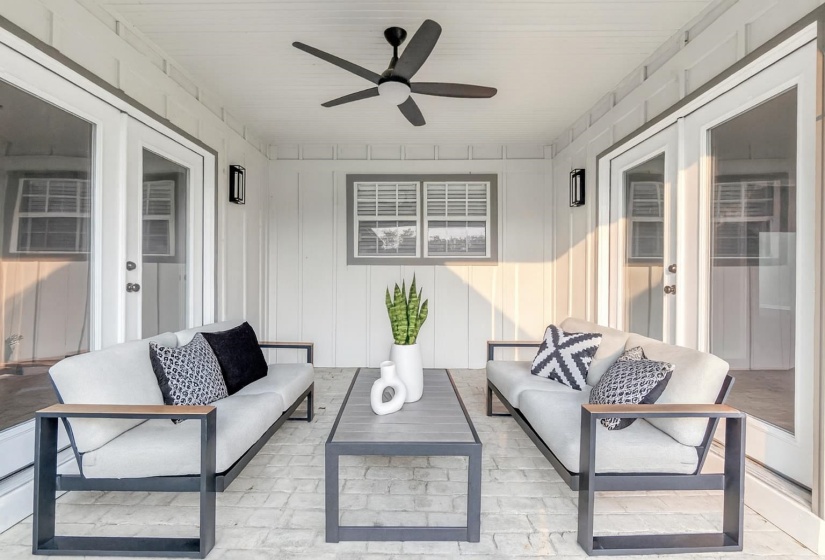 Sunroom featuring french doors