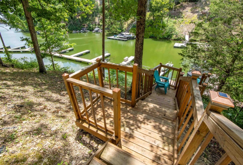 Deck featuring a boat dock and a water view