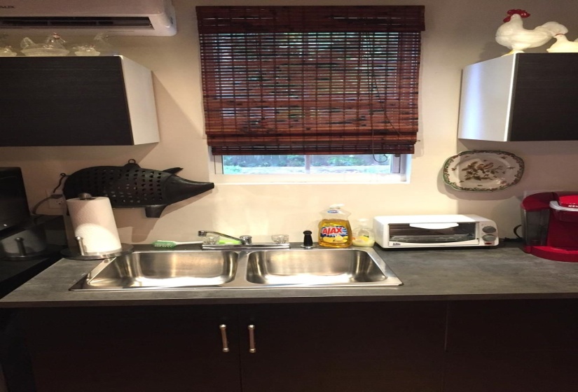 Kitchen featuring a mini split for heating / cooling and a sink