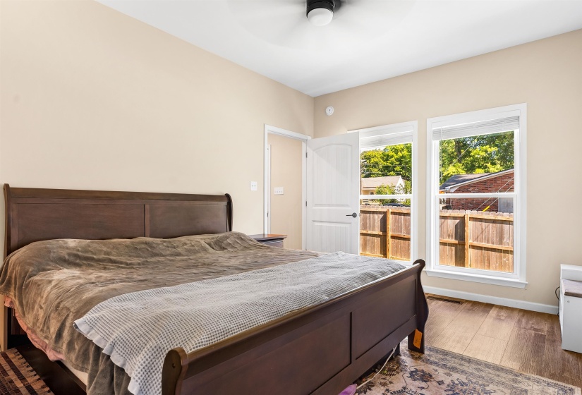Bedroom with wood finished floors and a ceiling fan
