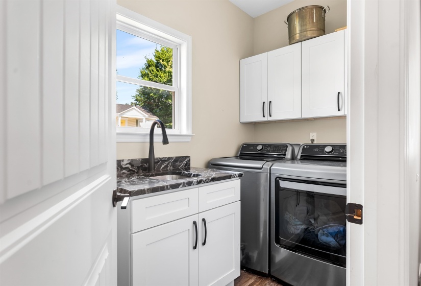Laundry area featuring cabinet space and separate washer and dryer
