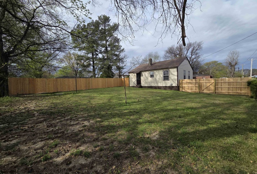 Fenced backyard with a gate