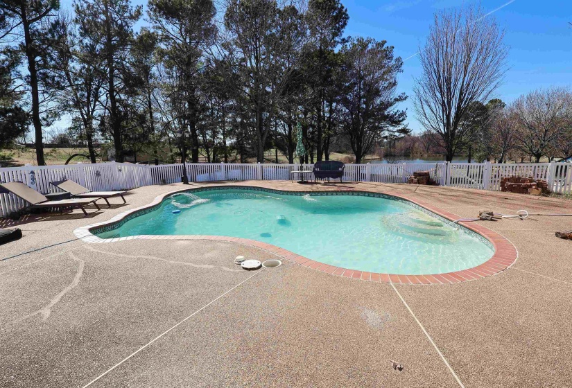 View of pool with a fenced in pool, a fenced backyard, and a patio