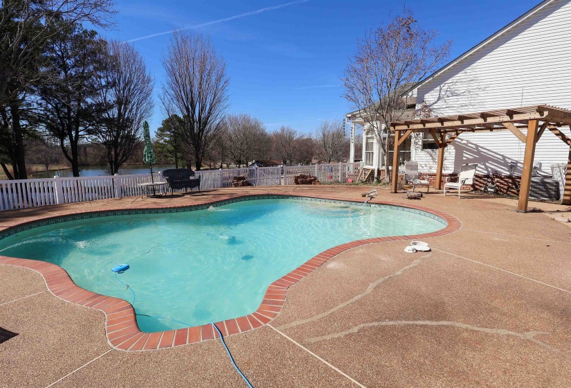 View of pool featuring a patio area, a fenced backyard, a fenced in pool, and a pergola