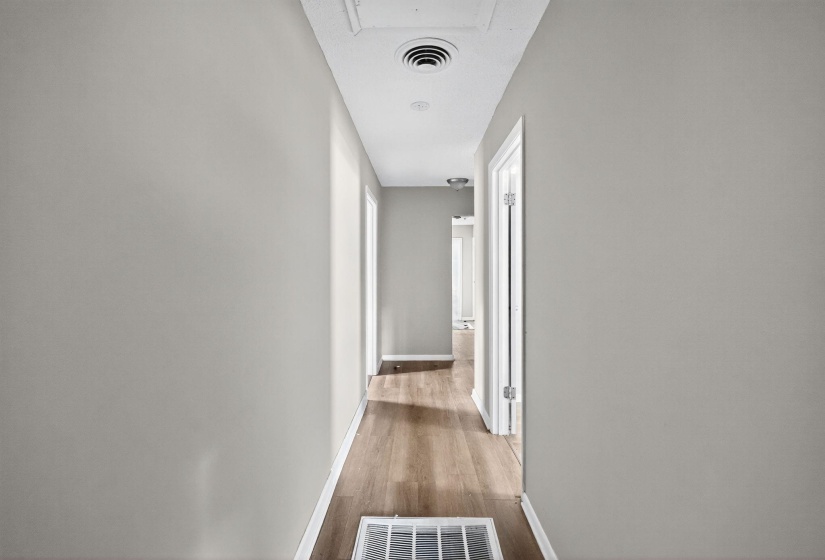 Hall featuring baseboards and light wood-type flooring
