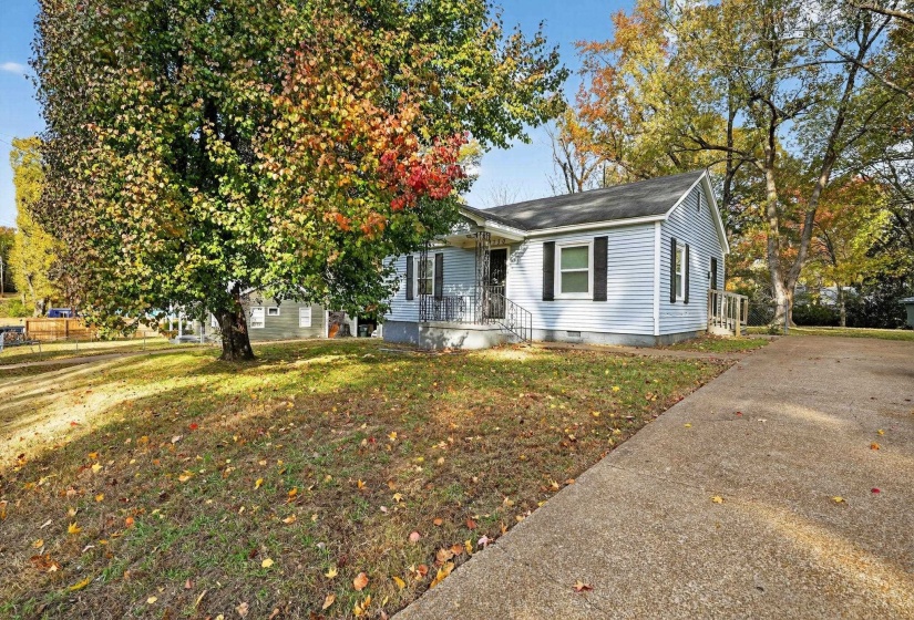 View of front facade with a front yard and crawl space