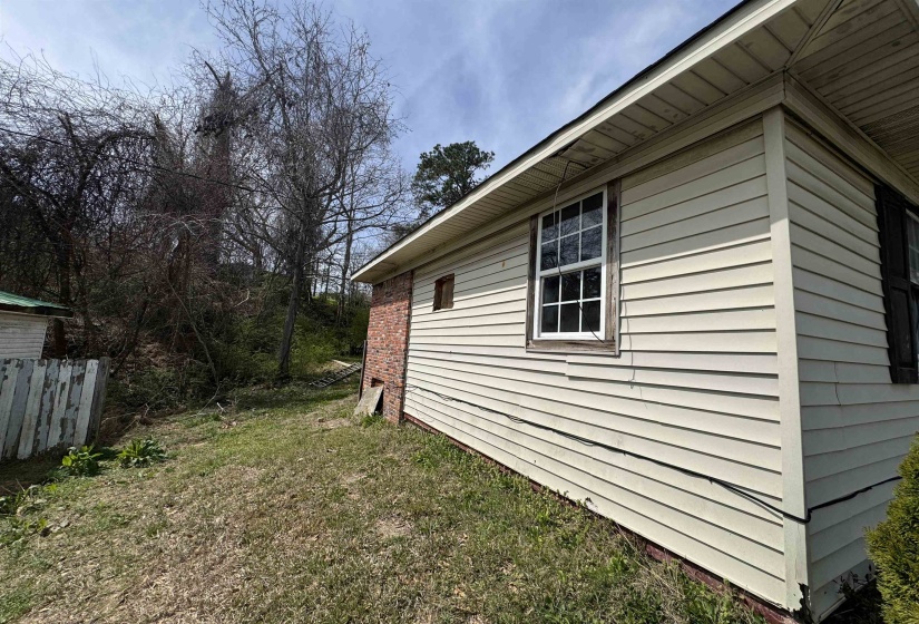 View of home's exterior featuring a lawn
