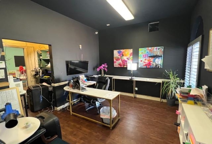 Office featuring dark wood-style floors
