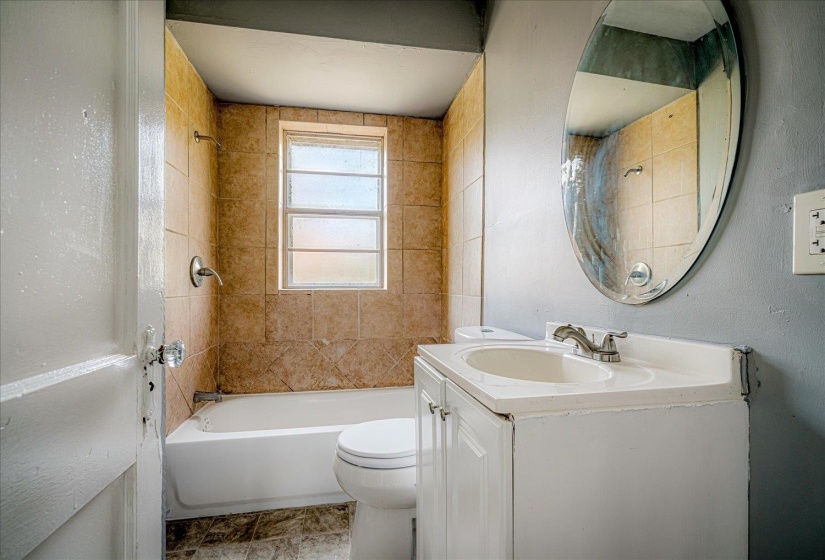 Full bathroom featuring shower / bathtub combination and vanity
