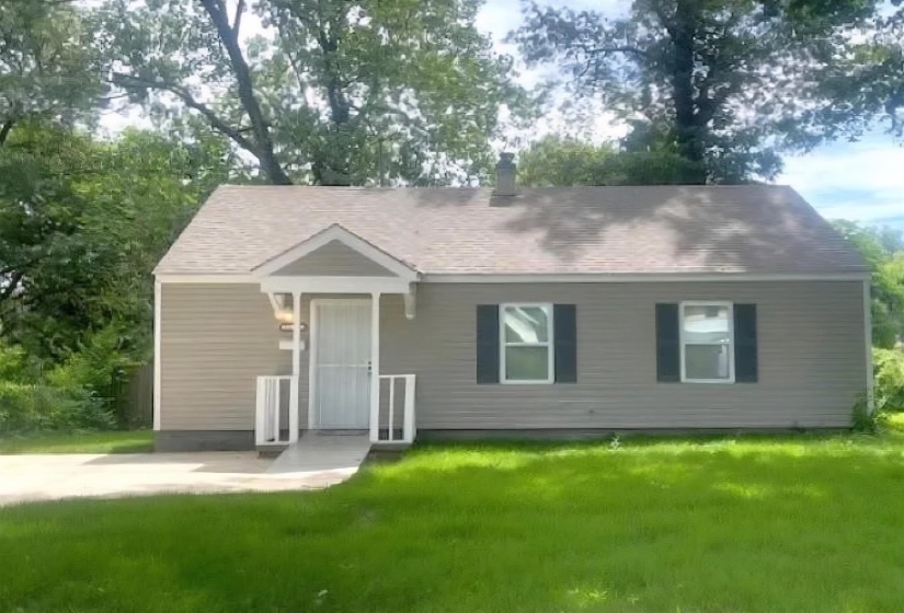 Single story home featuring a front lawn
