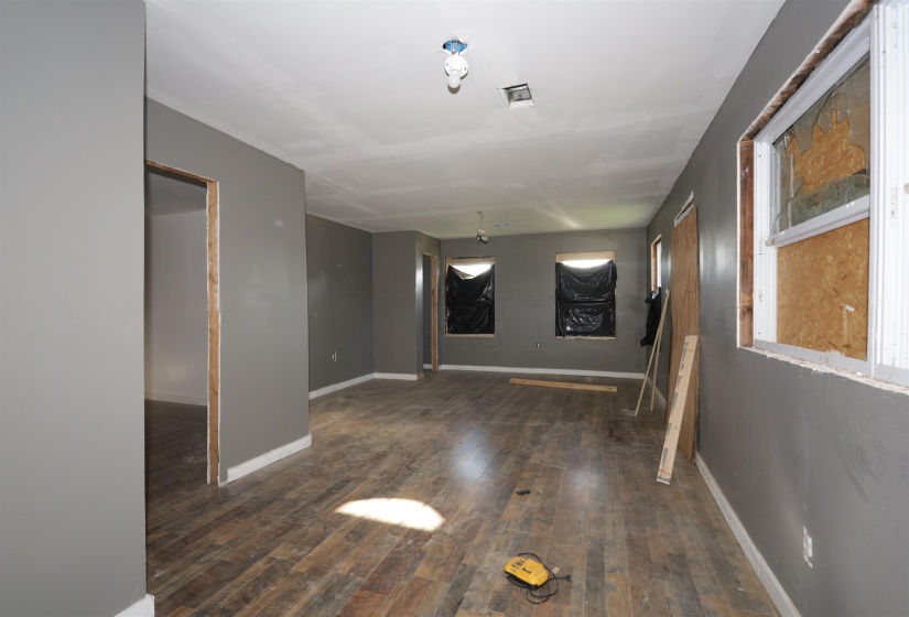 Empty room with dark wood-type flooring
