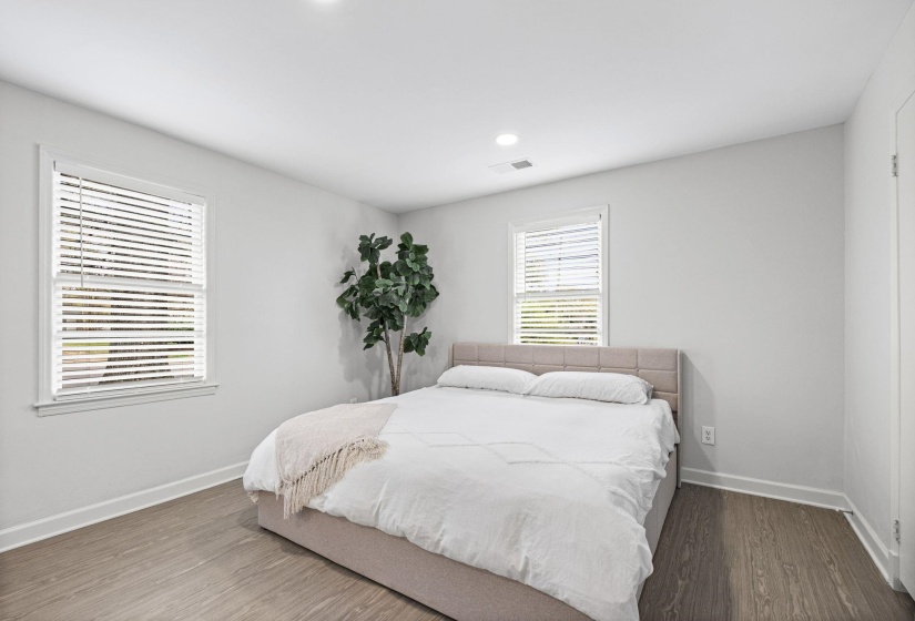 Bedroom featuring wood finished floors and recessed lighting