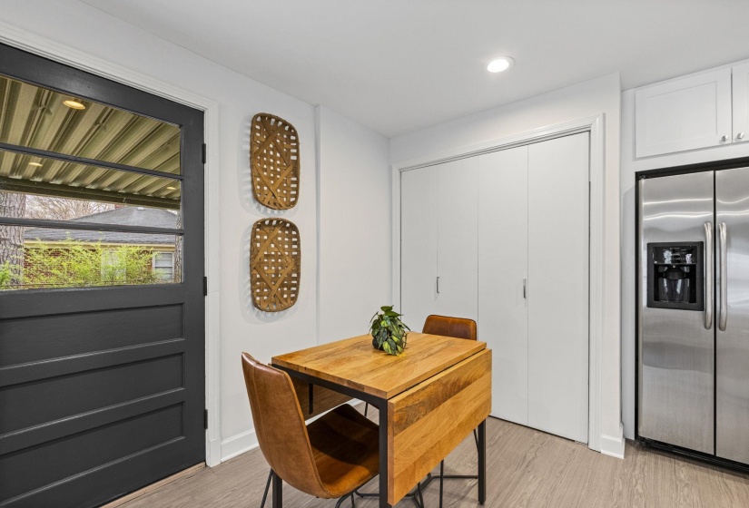 Dining room featuring light wood finished floors and recessed lighting