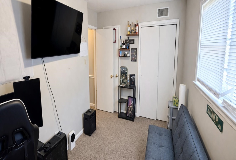 Office area featuring light carpet